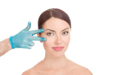 Cosmetic Surgeon checking the patient if its ready for eyelid surgery in Newport Beach, CA at Dr. George Brennan Office