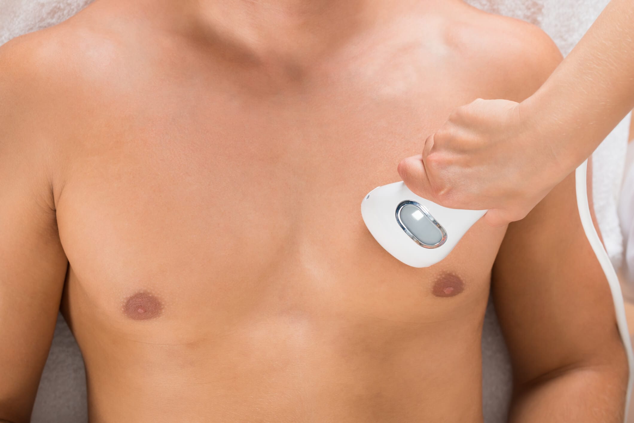Upper Chest Rejuvenation in Orange County Cosmetic Surgeon doing upper chest rejuvenation to a client in Newport Beach, CA at Dr. George Brennan Clinic